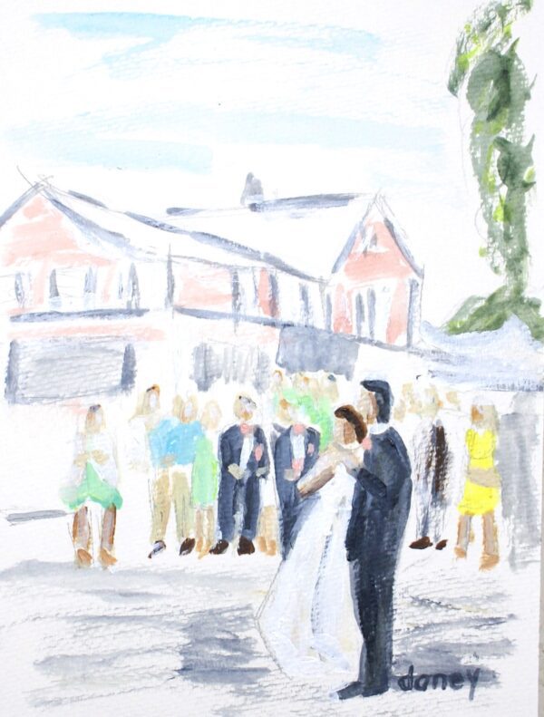 Wedding couple and guests outside building.